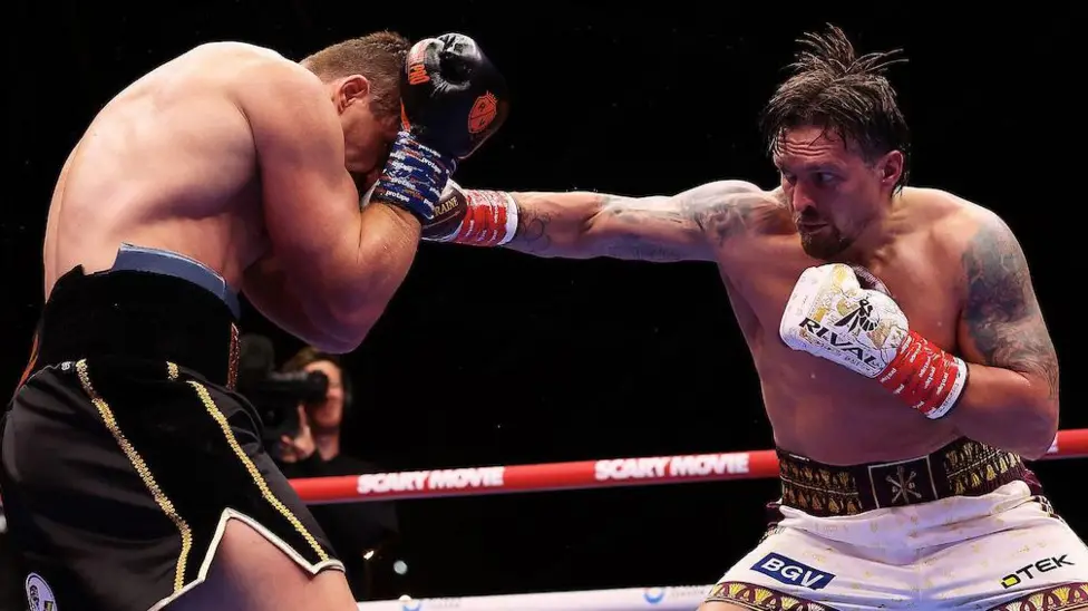 Usyk keeps titles with controversial...