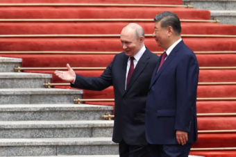 Putin says Russia-China ties at unprecedented level, invites Xi to Russia