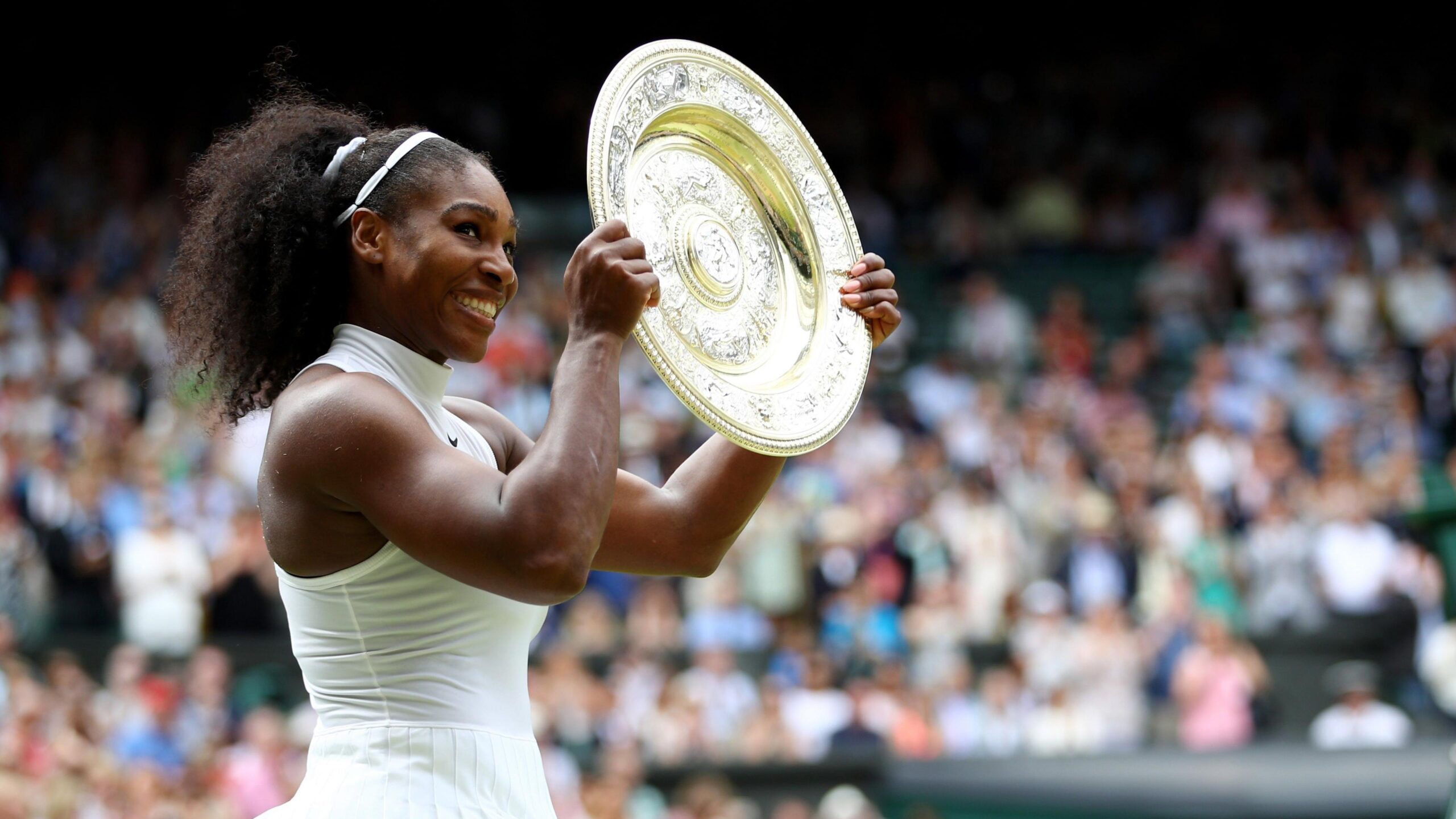 Serena Williams holds the Wimbledon women's singles trophy