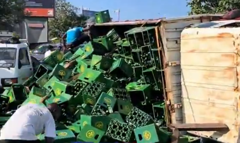 Kia Rhino truck carrying beer overturns at Shangri-La on Accra–Madina road