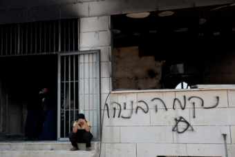 Israeli settlers set fire to West Bank mosques after deadly clash