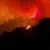 Fast-moving Canada wildfire doubles in size forcing thousands to flee homes