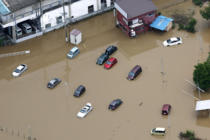 Heavy rain causes flooding near Tokyo that kills 4 and strands travellers