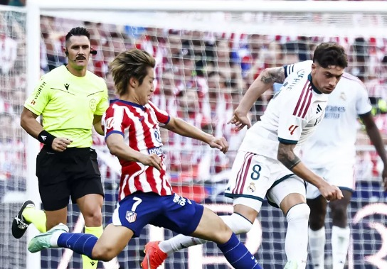 Atletico beat 10-man Real in feisty Madrid ...
