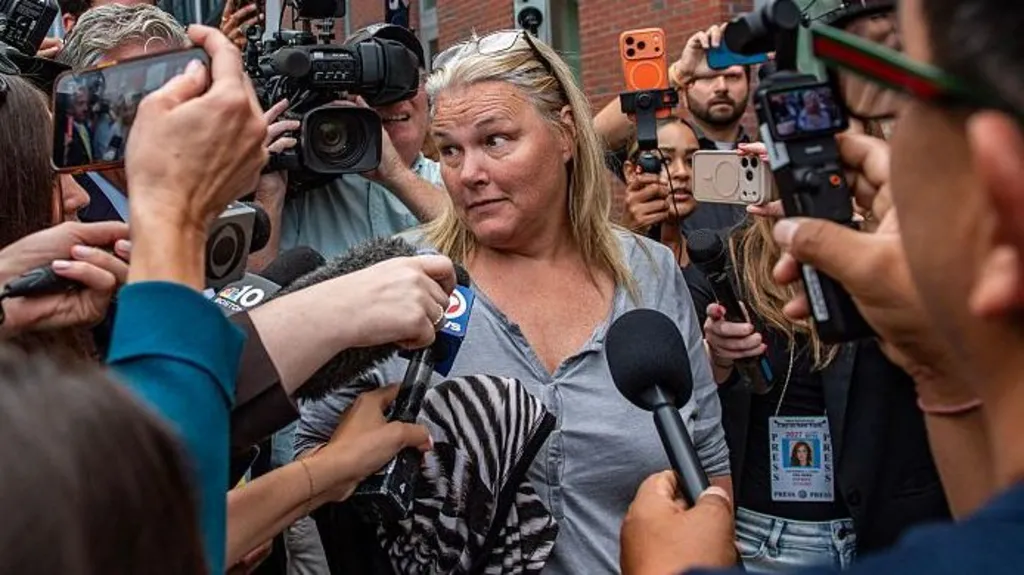 Woman charged with juror intimidation in...